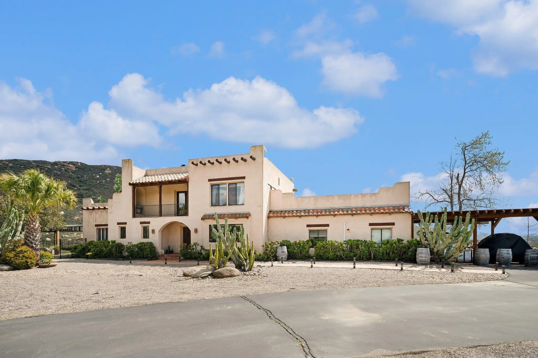 17287 Oak Hollow Road Ramona, CA 92065 - Photo 2 of 71 a front view of a house with a yard and car parked