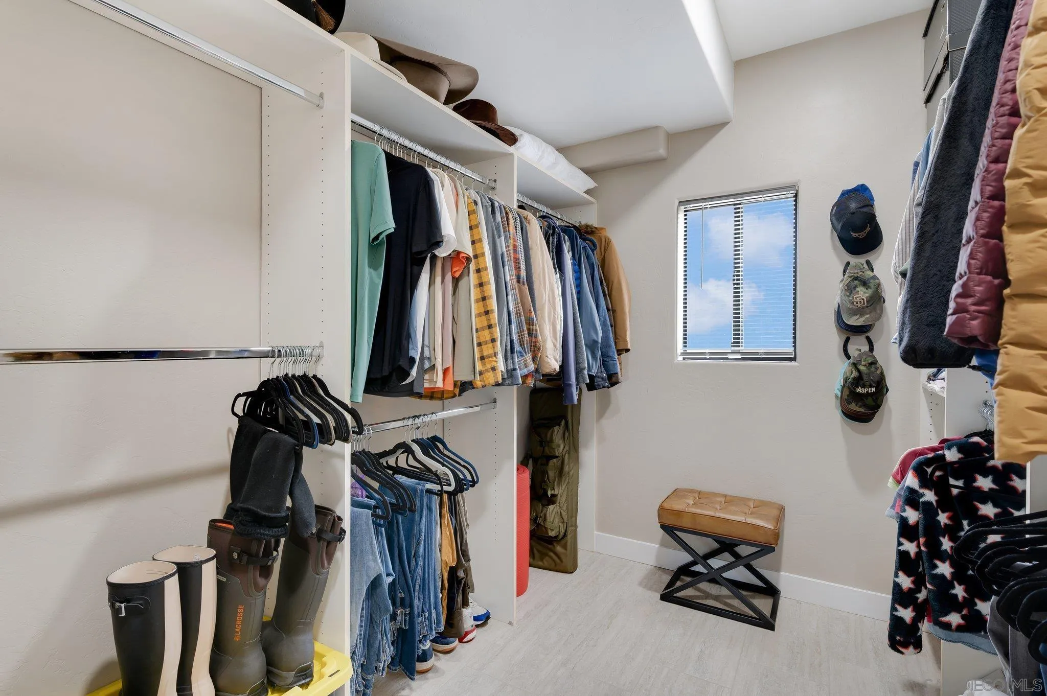 17287 Oak Hollow Road Ramona, CA 92065 - Photo 24 of 71 a view of walk in closet with clothes and shoes
