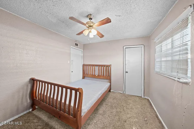 a view of a hallway with a bedroom