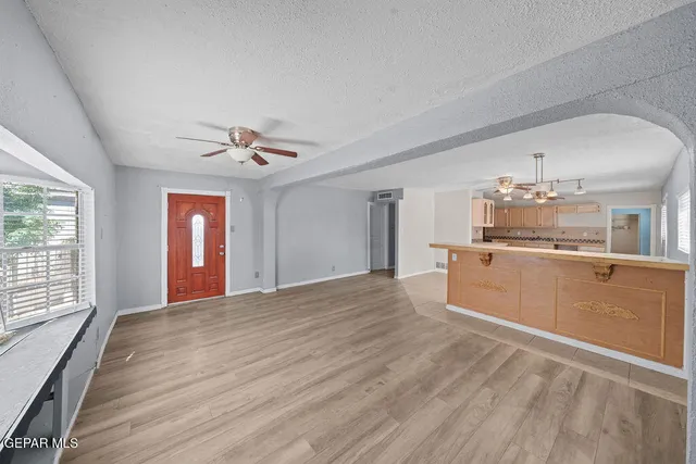 a view of a kitchen with microwave and cabinets