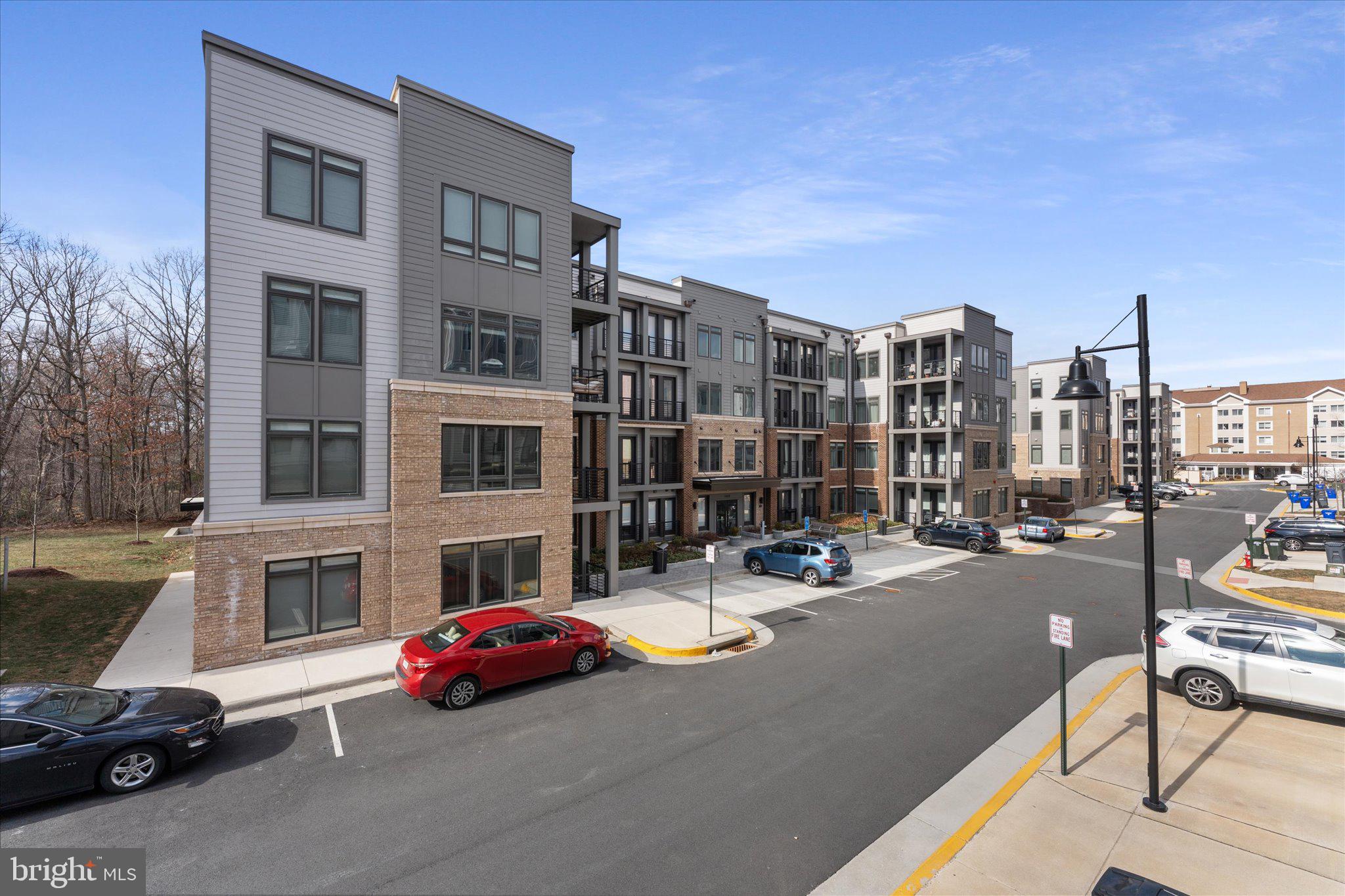 1669 Bandit Loop, Unit 206A Reston, VA 20190 - Photo 52 of 60 a car parked in front of a building