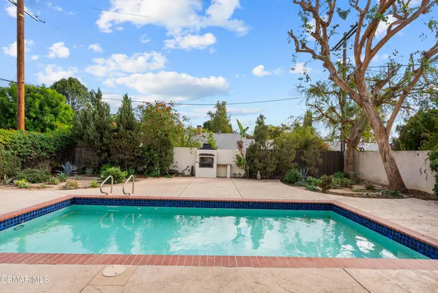 a outdoor view of a house with a backyard