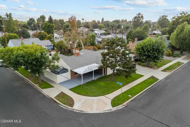 an aerial view of a house having yard