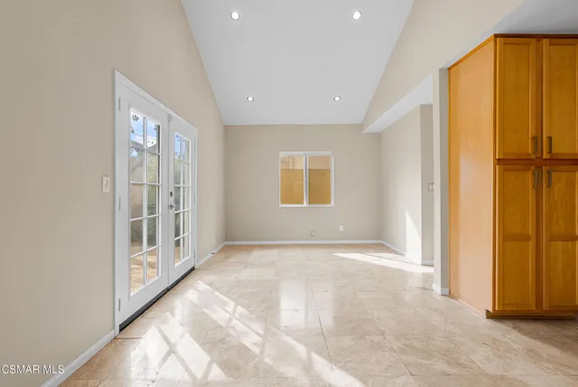 a view of an empty room with a window