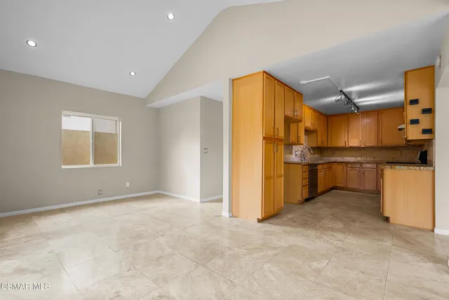 a view of a kitchen with furniture and a kitchen