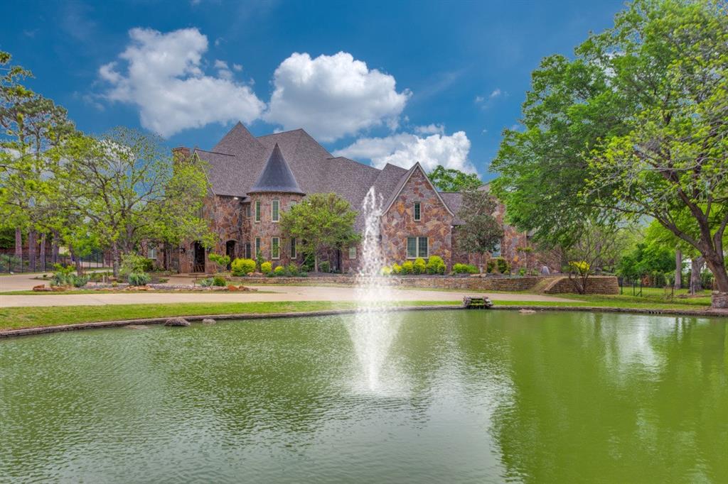 a view of swimming pool with outdoor seating and lake view