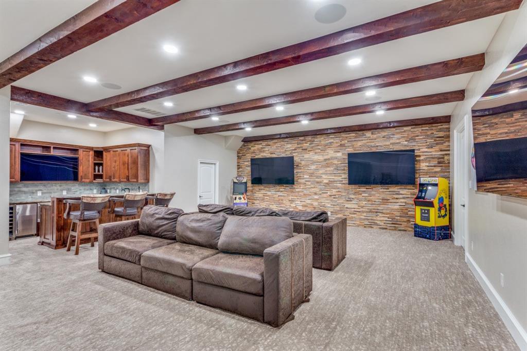 7212 John McCain Road Colleyville, TX 76034 - Photo 13 of 36 a living room with furniture and a flat screen tv