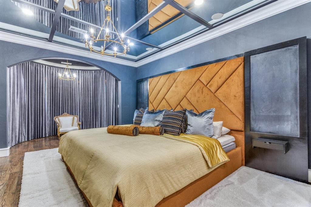 7212 John McCain Road Colleyville, TX 76034 - Photo 17 of 36 a bedroom with a bed and a chandelier