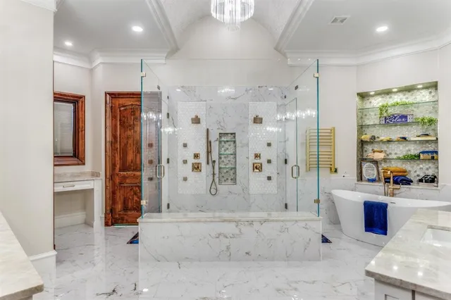 a large spacious bathroom with a large tub shower and sink