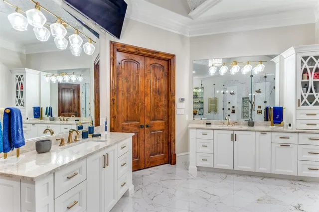 a spacious bathroom with a granite countertop sink mirror and a