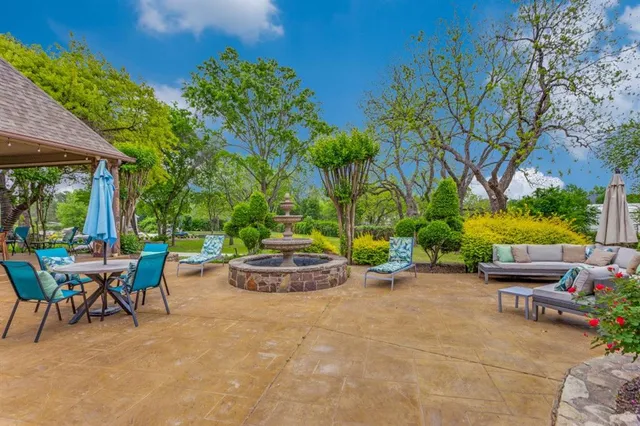 a view of swimming pool with trees in the background
