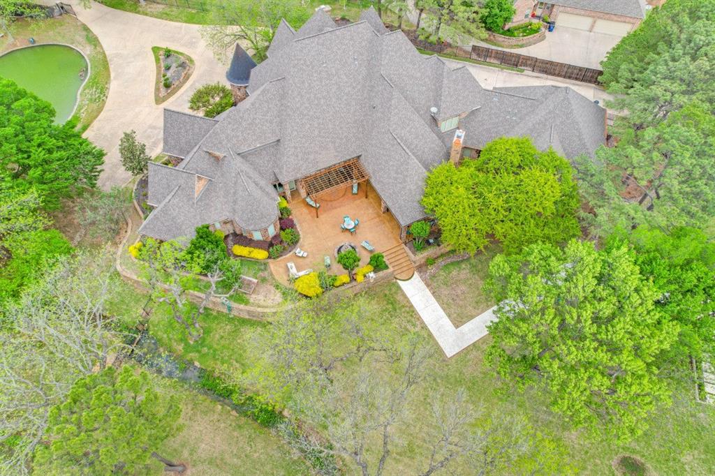7212 John McCain Road Colleyville, TX 76034 - Photo 33 of 36 an aerial view of a house with a yard and a large pool