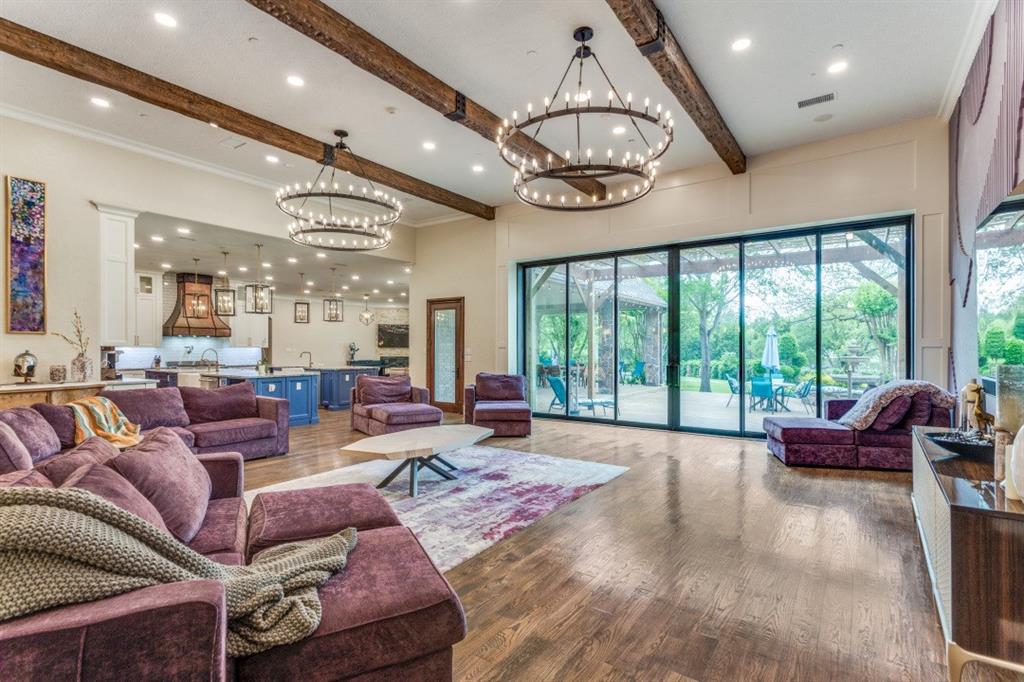 7212 John McCain Road Colleyville, TX 76034 - Photo 6 of 36 a living room with furniture ceiling fan and a large window
