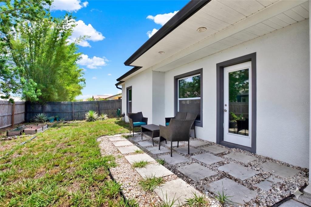 3023 Muir Street Holiday, FL 34691 - Photo 20 of 25 a view of a backyard with sitting area