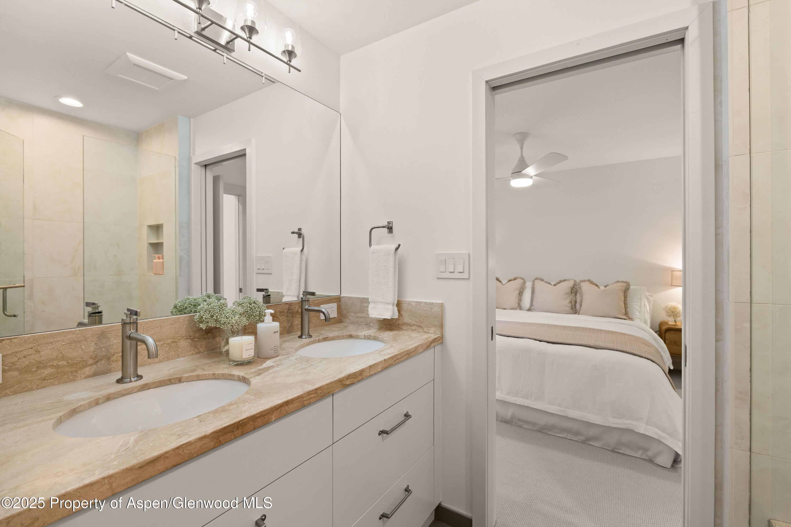 814 West Bleeker Street, Unit B2 Aspen, CO 81611 - Photo 12 of 17 a en suite bathroom with double sink and a mirror