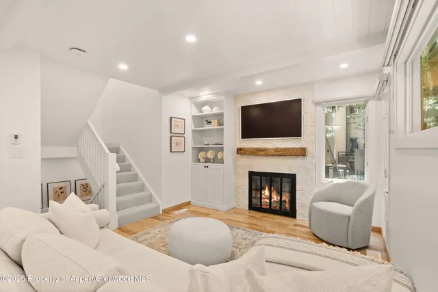 a bedroom with a bed and a fireplace