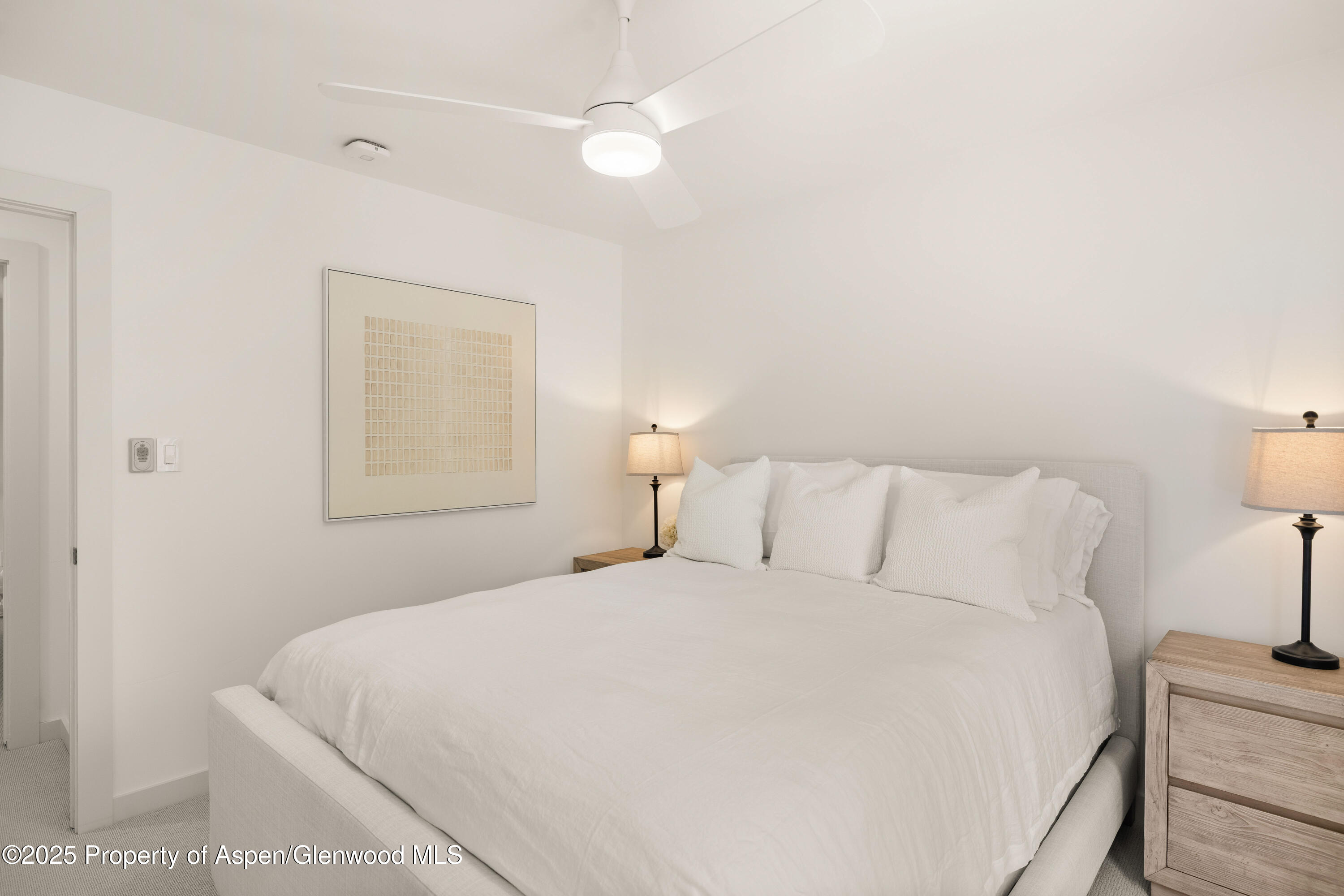 814 West Bleeker Street, Unit B2 Aspen, CO 81611 - Photo 10 of 17 a bedroom with a bed and a night stand