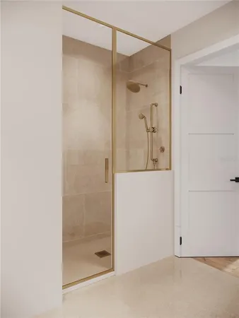 a bathroom with a glass shower door