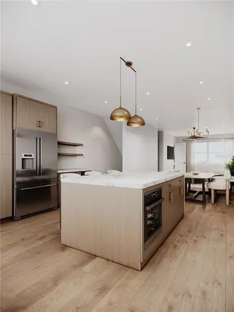 a kitchen with stainless steel appliances granite countertop a stove a sink and a refrigerator