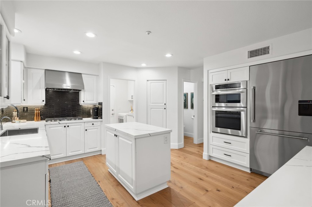 36 Regina Dana Point, CA 92629 - Photo 13 of 45 a kitchen with stainless steel appliances a refrigerator sink and microwave