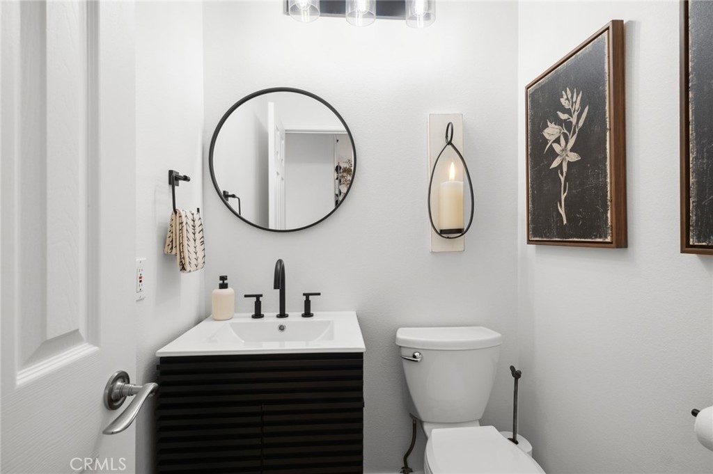 36 Regina Dana Point, CA 92629 - Photo 19 of 45 a bathroom with a toilet sink and mirror