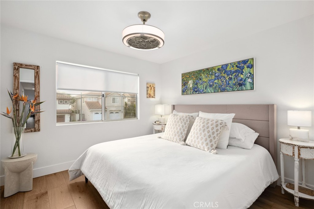 36 Regina Dana Point, CA 92629 - Photo 29 of 45 a bedroom with a large bed and a window