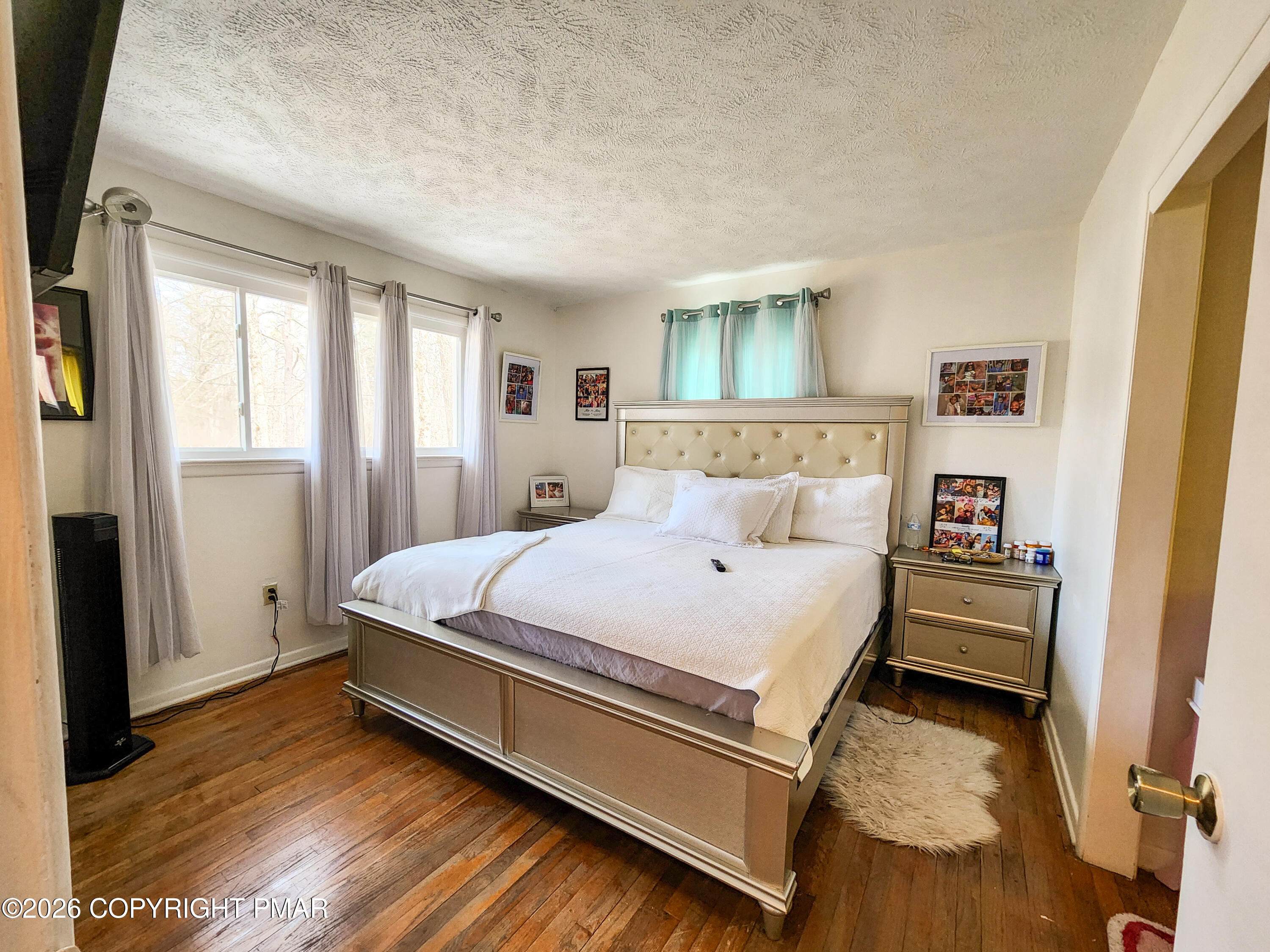 6319 Laurel Road Pocono Summit, PA 18346 - Photo 12 of 22 a bed room with a bed and a window