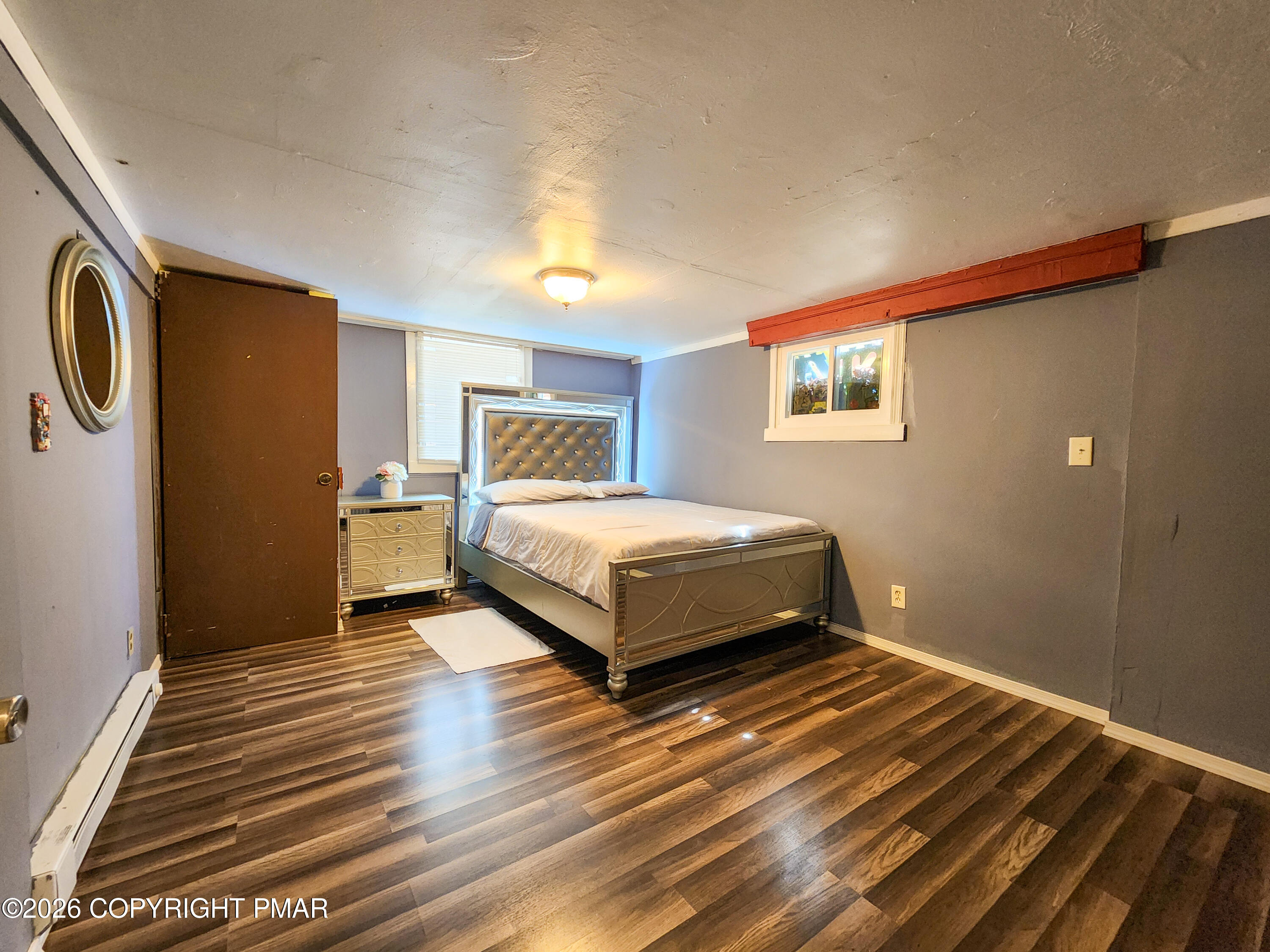 6319 Laurel Road Pocono Summit, PA 18346 - Photo 20 of 22 a bedroom with a bed and wooden floor