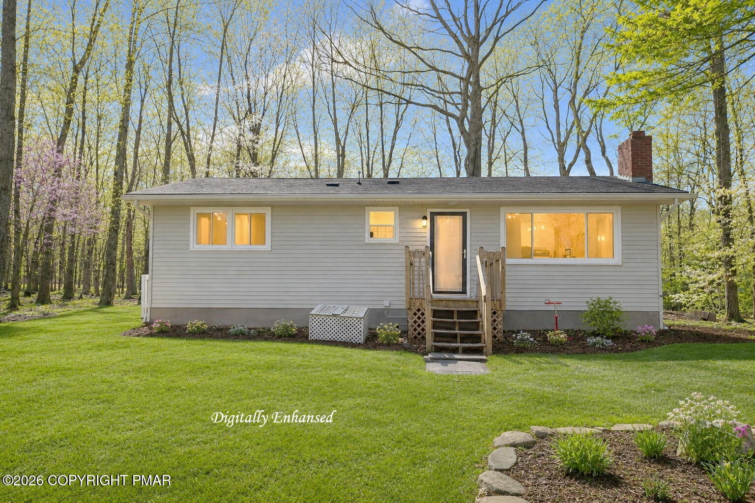 6319 Laurel Road Pocono Summit, PA 18346 - Photo 3 of 22 a front view of a house with a garden