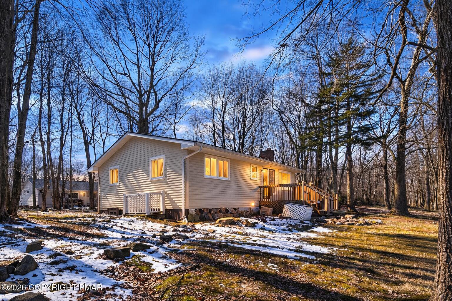 6319 Laurel Road Pocono Summit, PA 18346 - Photo 5 of 22 a front view of a house with a yard