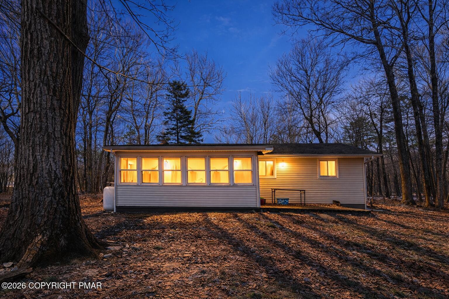 6319 Laurel Road Pocono Summit, PA 18346 - Photo 6 of 22 a view of a backyard with a garden