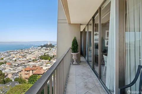 a view of a balcony with furniture