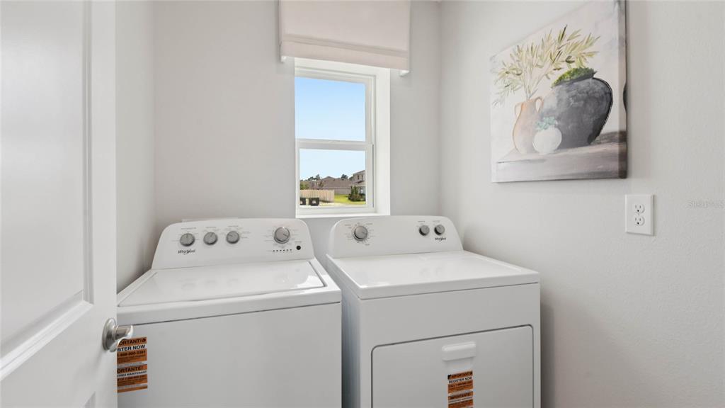 24324 Northwest 10th Road Newberry, FL 32669 - Photo 18 of 20 a utility room with dryer and washer