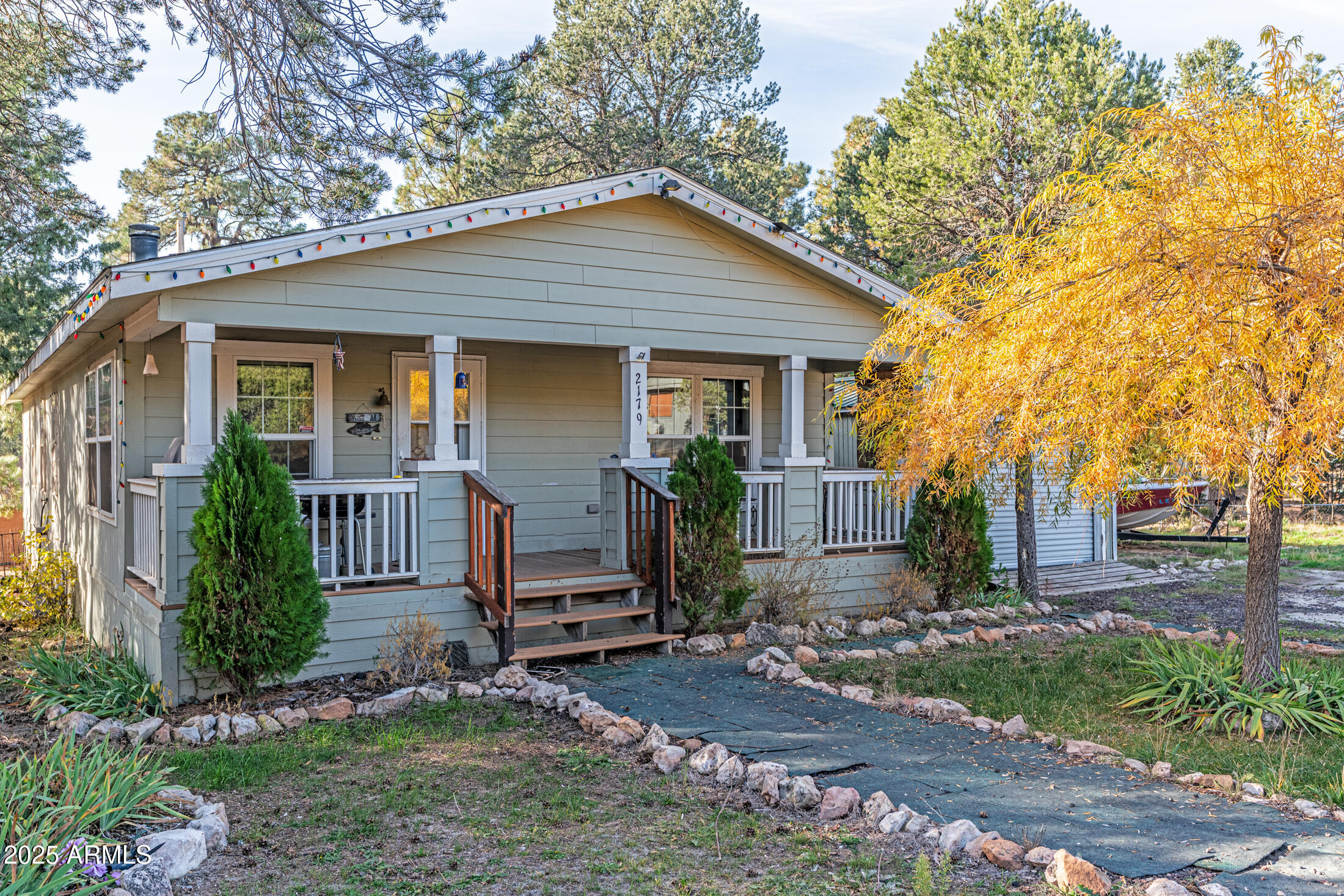 a front view of house with a garden