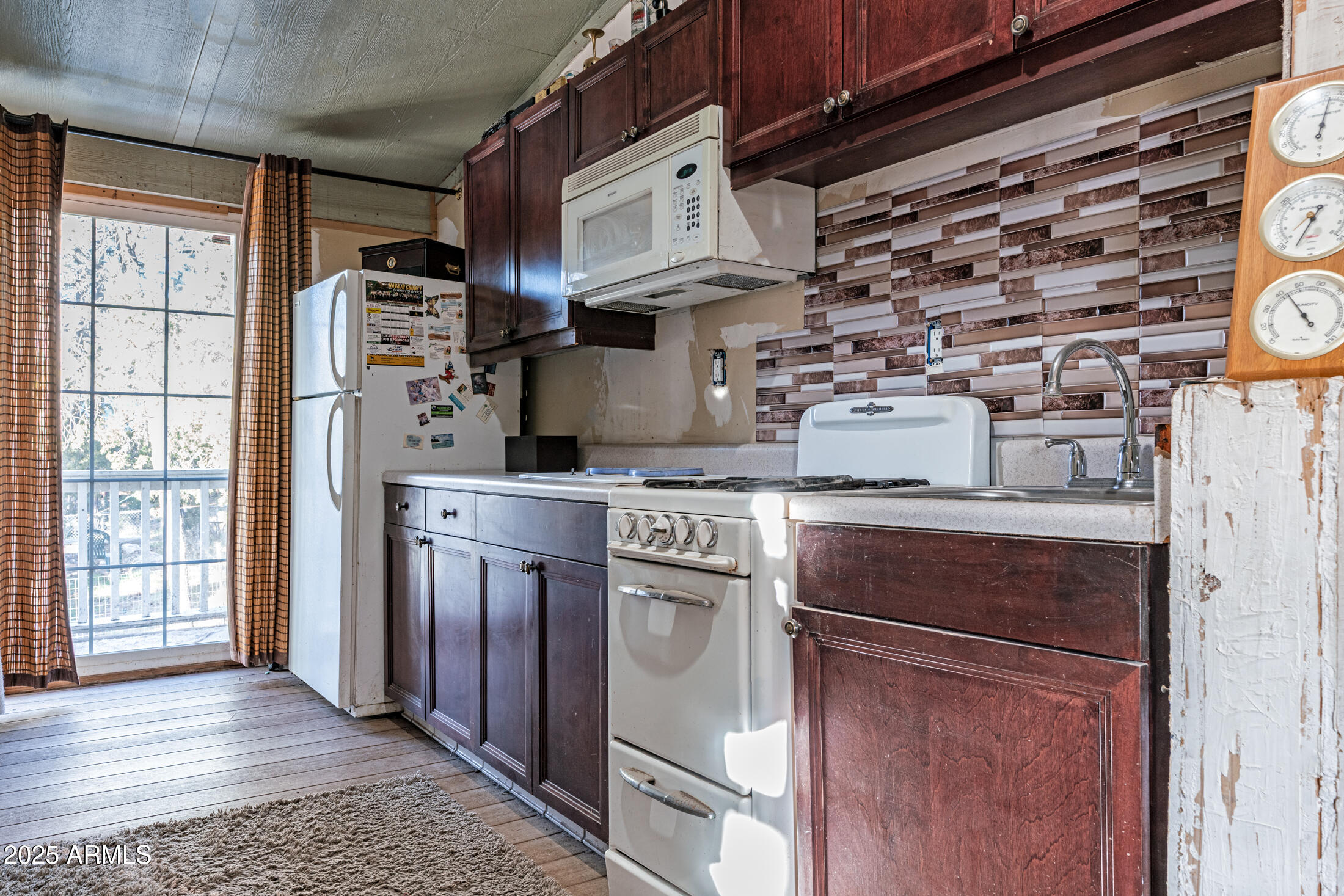 2179 Hackamore Drive Overgaard, AZ 85933 - Photo 17 of 26 a kitchen with stainless steel appliances granite countertop a stove and a refrigerator