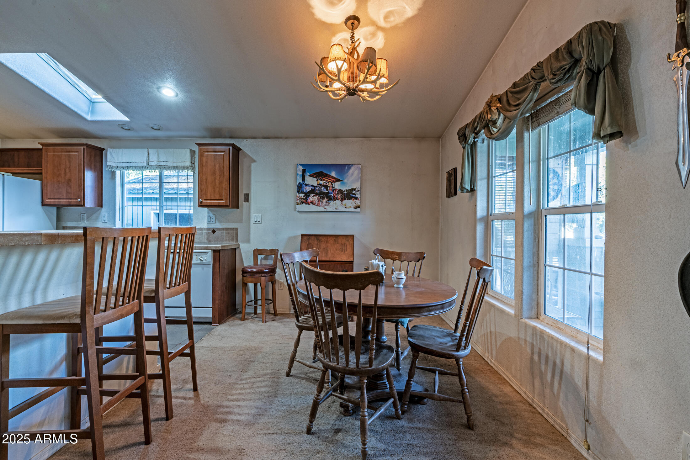 2179 Hackamore Drive Overgaard, AZ 85933 - Photo 9 of 26 a view of a dining room with furniture and wooden floor