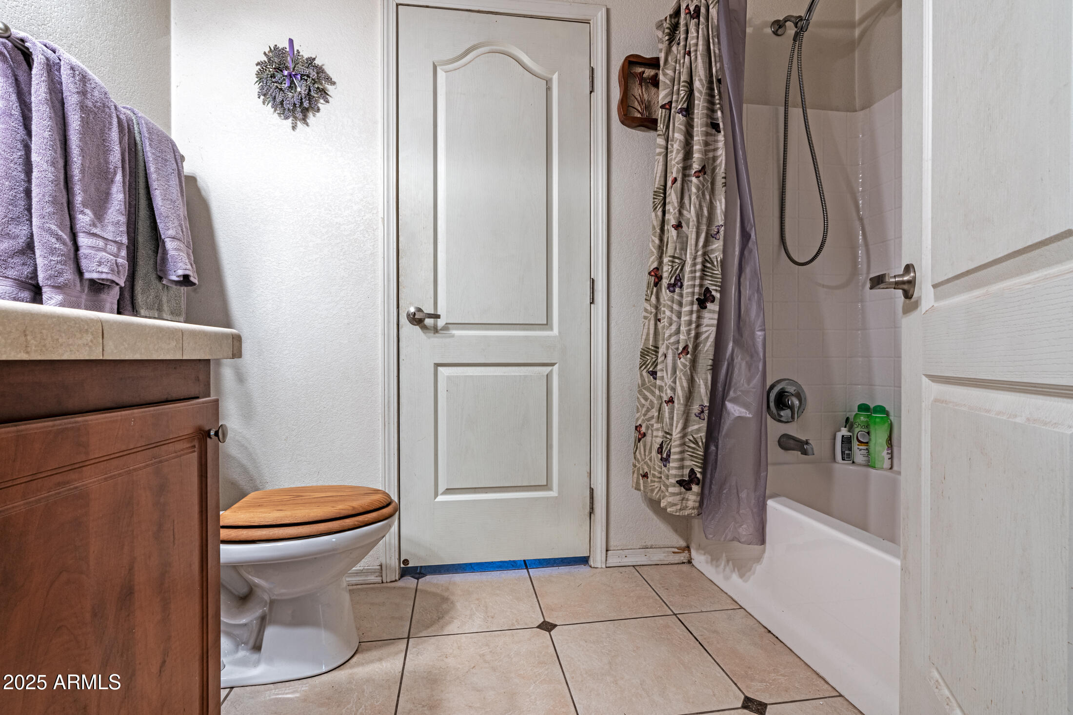 2179 Hackamore Drive Overgaard, AZ 85933 - Photo 10 of 26 a bathroom with a granite countertop sink toilet and shower
