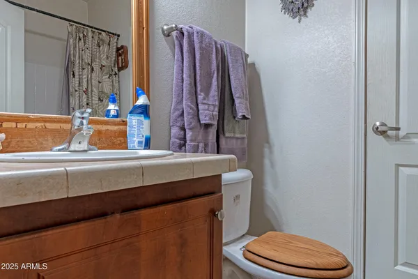 a bathroom with a toilet and a sink