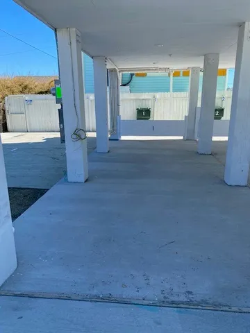 a view of an empty room with a fireplace