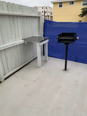 a view of a backyard with sitting area