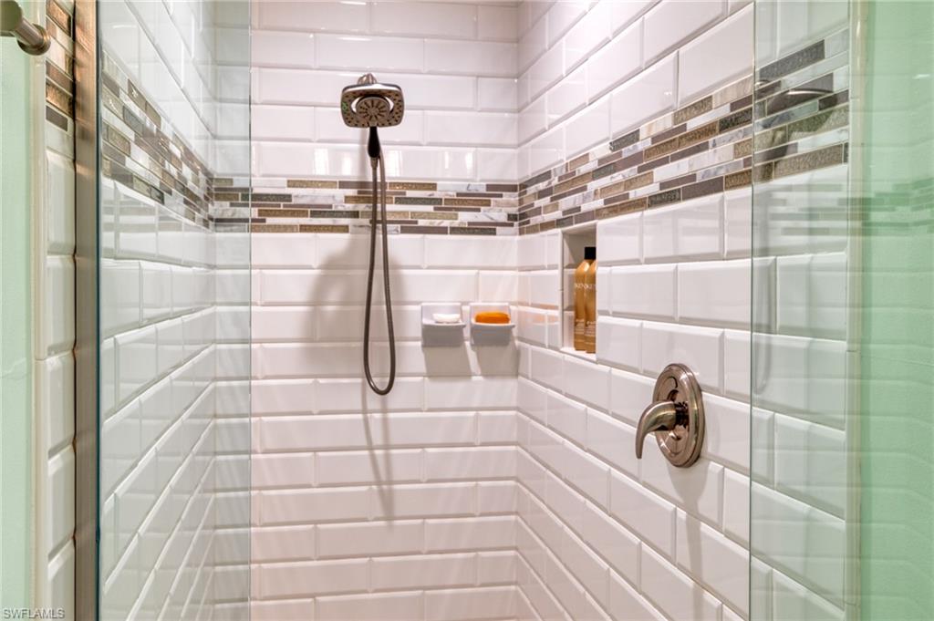 1638 Triangle Palm Terrace Naples, FL 34119 - Photo 11 of 30 a bathroom with a shower