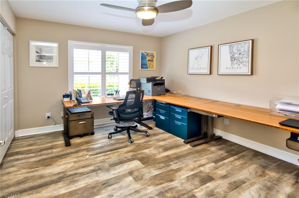 1638 Triangle Palm Terrace Naples, FL 34119 - Photo 13 of 30 a work room with furniture and windows
