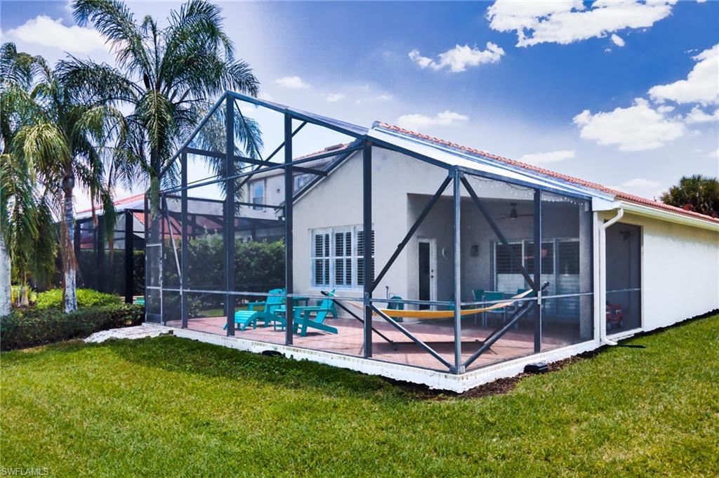 1638 Triangle Palm Terrace Naples, FL 34119 - Photo 18 of 30 a garden view with a sitting space