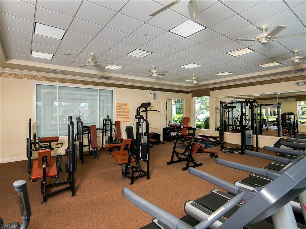 1638 Triangle Palm Terrace Naples, FL 34119 - Photo 27 of 30 a view of a room with gym equipment