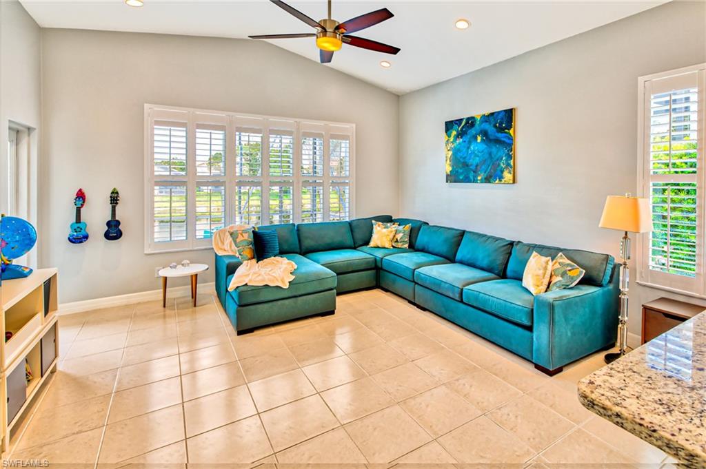 1638 Triangle Palm Terrace Naples, FL 34119 - Photo 8 of 30 a living room with furniture and a window