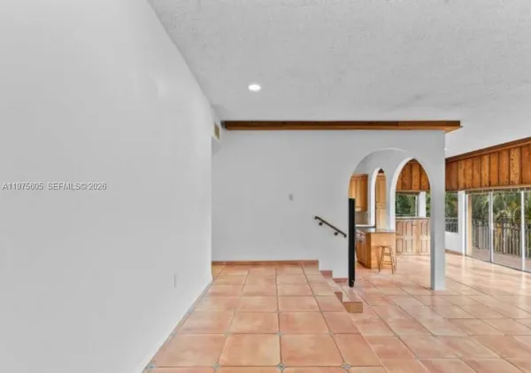 a view of a hallway with entryway