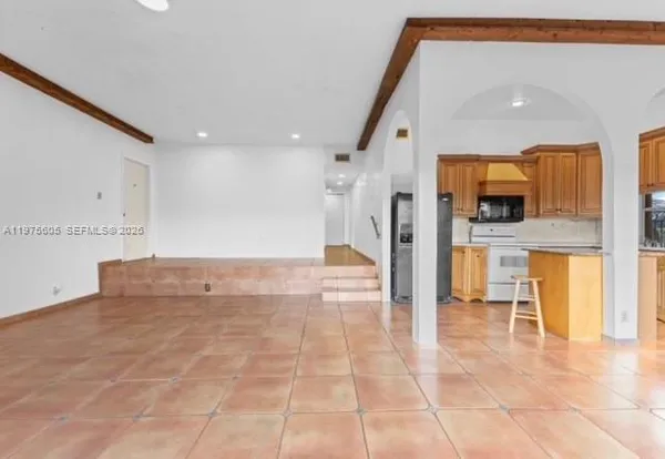 a view of a kitchen with a sink