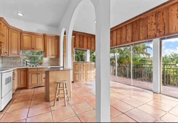 a view of kitchen with furniture and large window