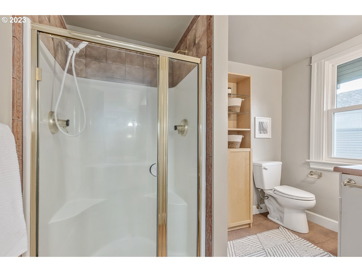 1410 Southeast 35th Avenue Portland, OR 97214 - Photo 22 of 39 a bathroom with a shower a toilet and a shower
