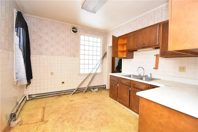 a room with a window a sink and a counter top space